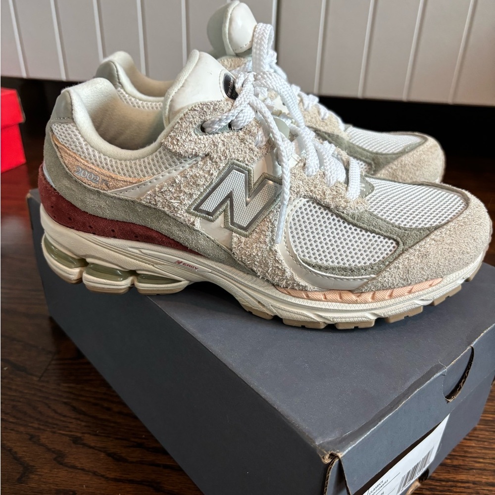 New Balance 2002R Cream and Gray Sneakers with Red Accents